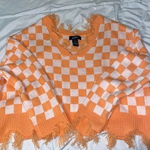 Checker board Orange and white sweater - Good condition